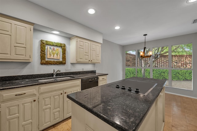 kitchen with dark stone counters, sink, a notable chandelier, a kitchen island, and electric stovetop