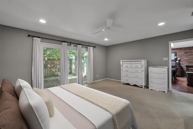 carpeted bedroom featuring access to exterior and ceiling fan