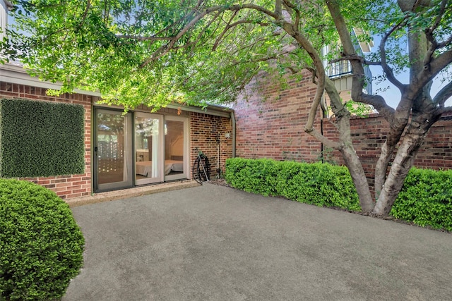 doorway to property featuring a patio area