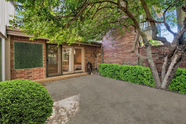 entrance to property with a patio