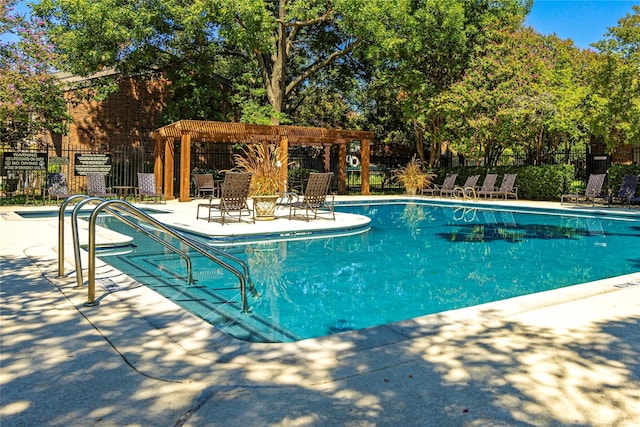 view of swimming pool with a pergola and a patio area