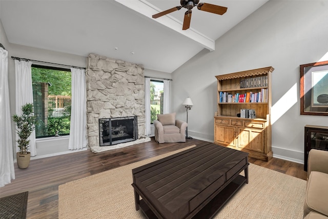 living room featuring a fireplace, vaulted ceiling with beams, ceiling fan, and dark wood-type flooring