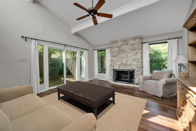 living room featuring a fireplace, ceiling fan, dark hardwood / wood-style flooring, and a healthy amount of sunlight