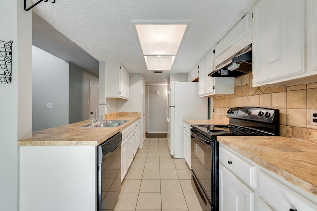 kitchen with exhaust hood, white cabinetry, sink, and black appliances