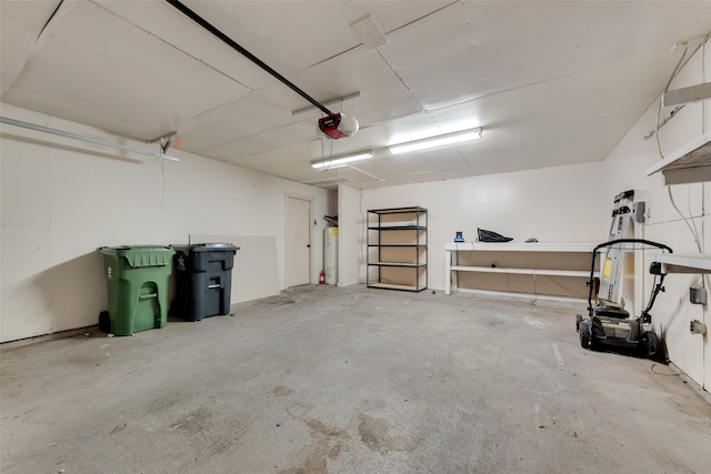 garage featuring gas water heater and a garage door opener