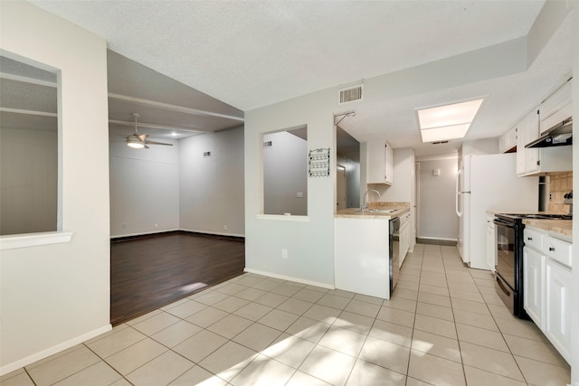 kitchen featuring white cabinets, sink, black range with electric cooktop, and light hardwood / wood-style flooring