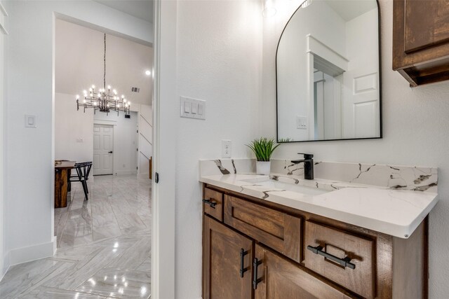 bathroom featuring vanity and an inviting chandelier