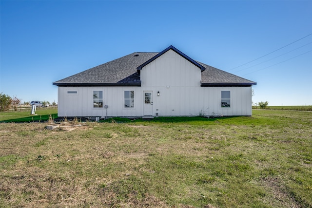 view of side of home featuring a lawn