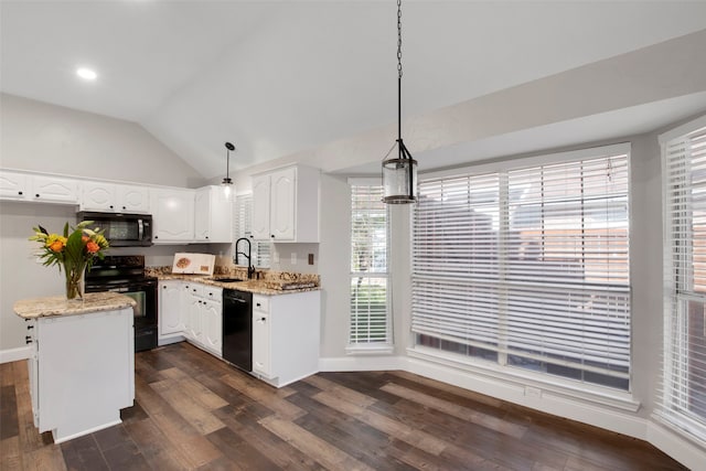 kitchen featuring pendant lighting, white cabinets, black appliances, vaulted ceiling, and a kitchen island