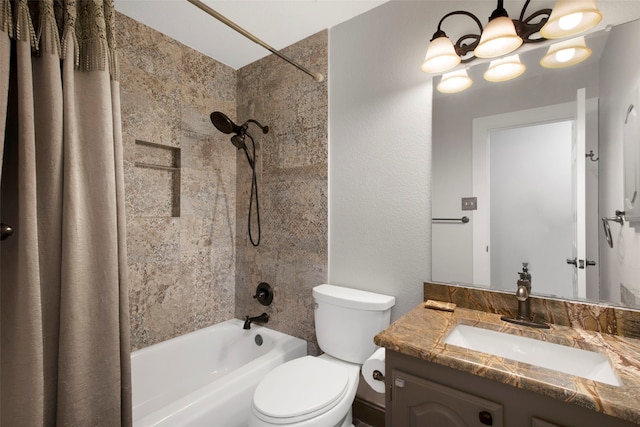 full bathroom featuring an inviting chandelier, vanity, shower / bath combo, and toilet