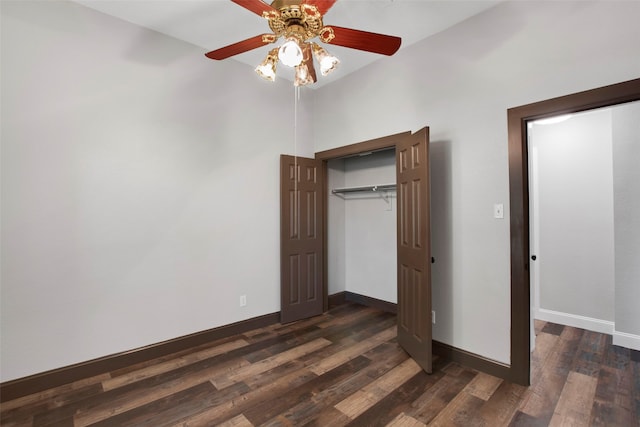 unfurnished bedroom with a closet, ceiling fan, and dark wood-type flooring