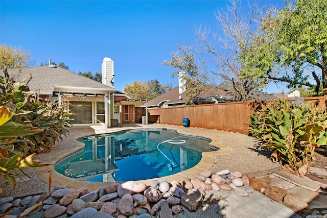 view of swimming pool with a patio