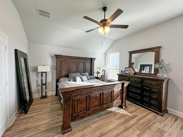 bedroom with lofted ceiling and ceiling fan