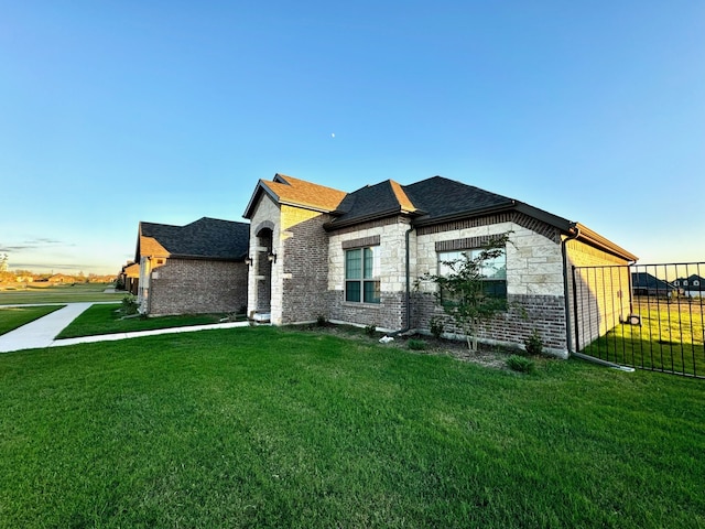 view of home's exterior with a lawn