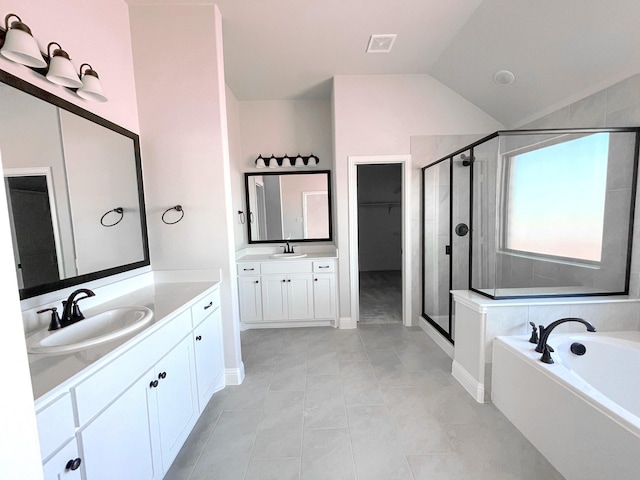 bathroom featuring tile patterned flooring, plus walk in shower, vaulted ceiling, and vanity