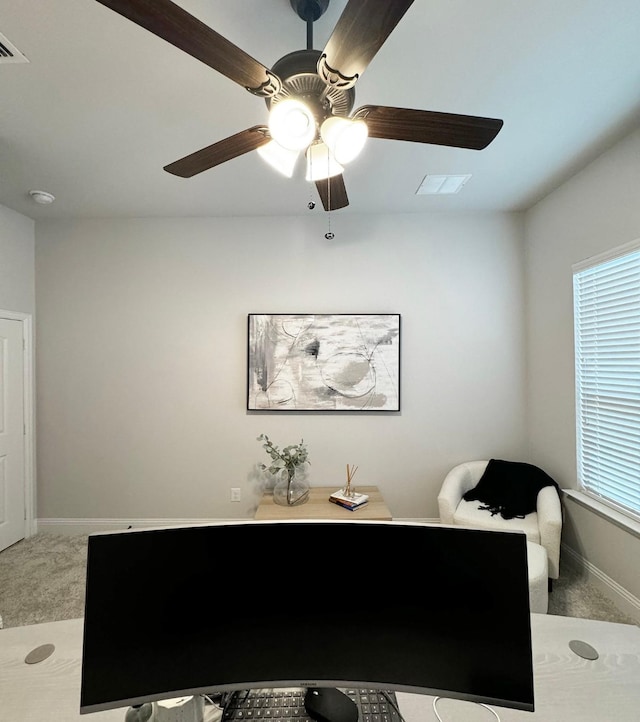 home office featuring ceiling fan, a healthy amount of sunlight, and carpet flooring