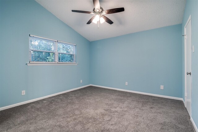 unfurnished room featuring a textured ceiling, ceiling fan, carpet floors, and vaulted ceiling