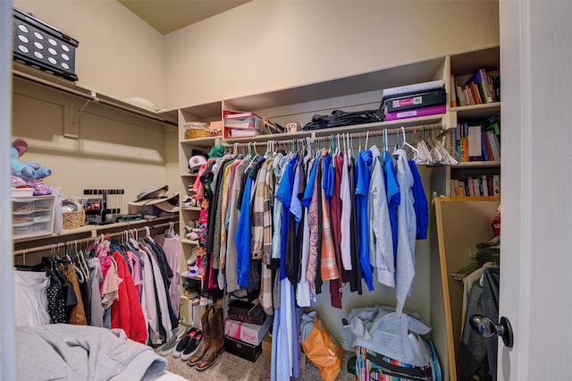 walk in closet featuring carpet