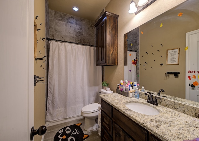 full bathroom with vanity, toilet, and shower / bath combo with shower curtain