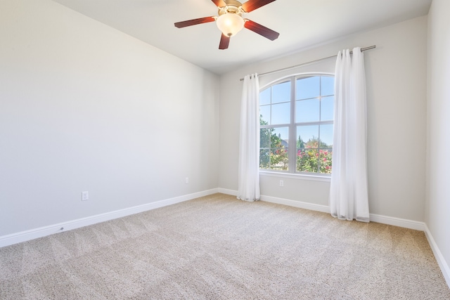 unfurnished room featuring carpet and ceiling fan