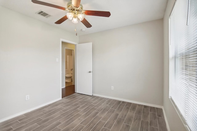 spare room featuring ceiling fan and hardwood / wood-style floors