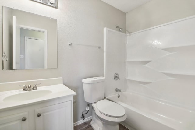 full bathroom featuring hardwood / wood-style flooring, vanity, shower / bathtub combination, and toilet