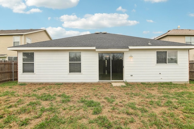 back of house featuring a yard