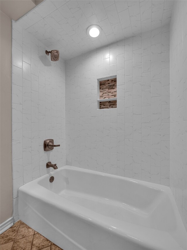 bathroom with tile patterned flooring and tiled shower / bath combo