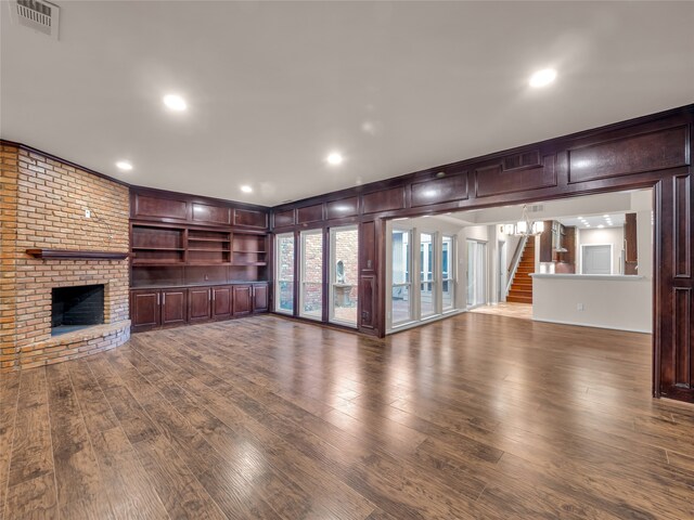 unfurnished living room with a fireplace and hardwood / wood-style floors