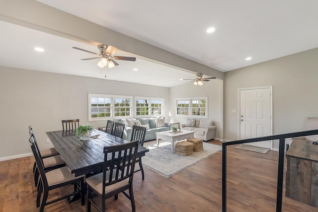 dining space featuring wood-type flooring, vaulted ceiling, and ceiling fan