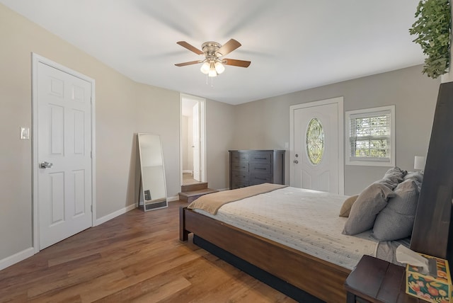 bedroom with wood-type flooring and ceiling fan