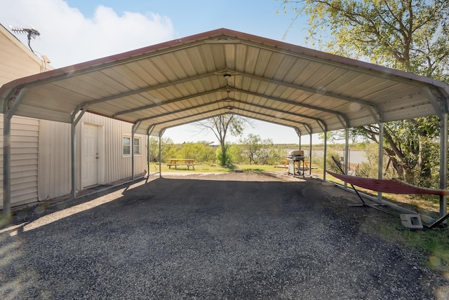 view of parking / parking lot with a carport