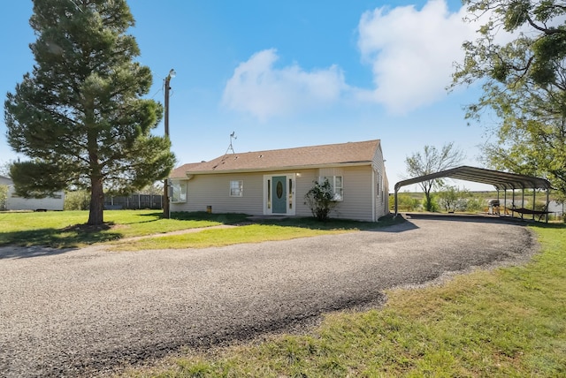 exterior space featuring a yard and a carport