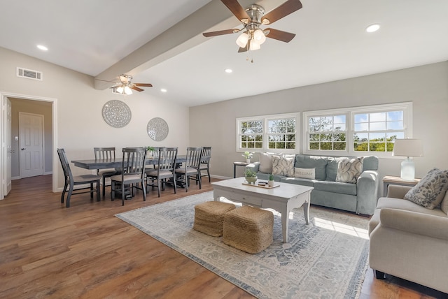 living room with ceiling fan, lofted ceiling with beams, and hardwood / wood-style flooring