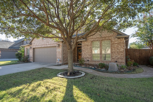 view of front facade featuring a garage and a front yard