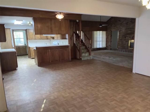 kitchen with light parquet flooring and kitchen peninsula