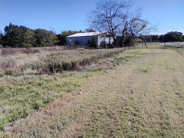 view of yard with a rural view