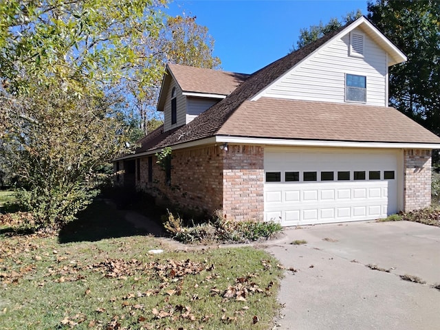 view of side of property with a garage