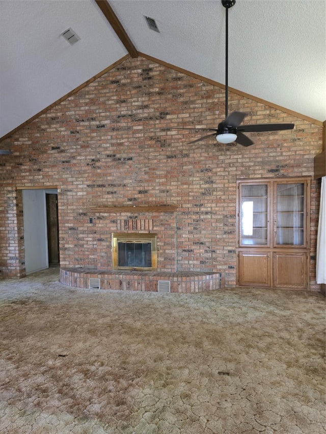 unfurnished living room featuring ceiling fan, carpet, a textured ceiling, and vaulted ceiling with beams