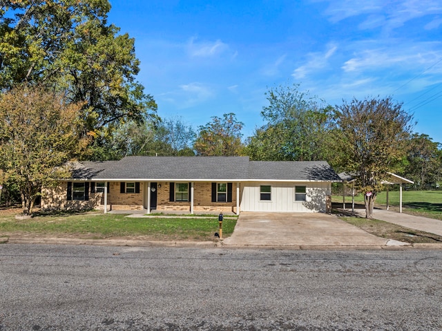 ranch-style house with a front lawn and a carport