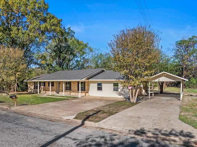 single story home featuring covered porch and a front yard