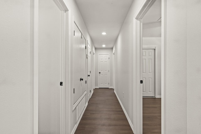 hall with dark hardwood / wood-style floors