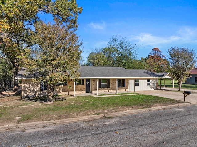 single story home with a carport and a front yard