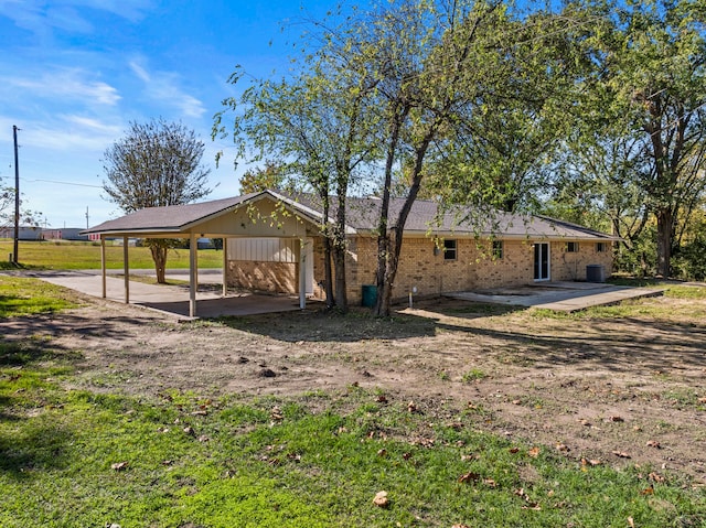 view of property exterior with a patio area