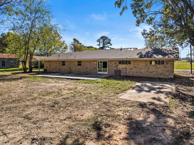 back of house with a patio