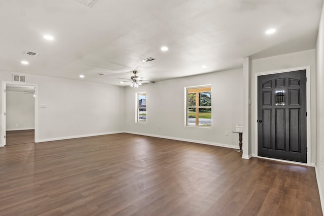 entryway featuring ceiling fan and dark wood-type flooring