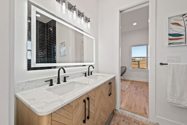 bathroom featuring hardwood / wood-style floors and vanity