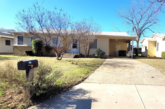 single story home with a front yard and a carport