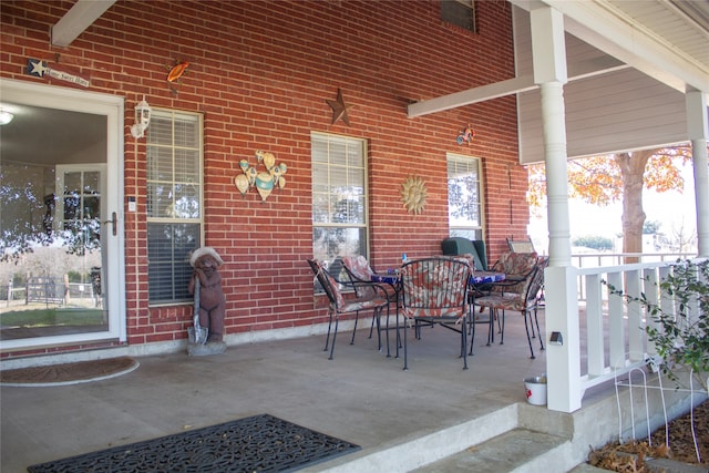 view of patio featuring a porch