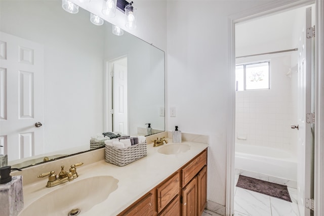 bathroom featuring vanity and tiled shower / bath combo